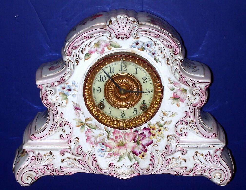 Ansonia Clock Co., "Dresden" model, Circa 1905, 8-day time/strike porcelain mantel clock. Information on the back states this clock was manufactured for the American Wringer Co., No. 99 Chambers St., New York. This was Ansonia's domestic version of their imported "LaNord" case, with only minor variations. — Antique Clocks Price Guide