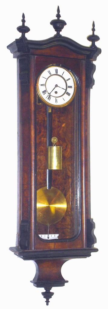 German, Gustav Becker, Freiburg S, c.1871, small 1-wt "Vienna Regulator" in a walnut veneer case, with burled back panel and ebonized finials and trim, and with 4.25" dial, serial No. 43286. — Antique Clocks Price Guide