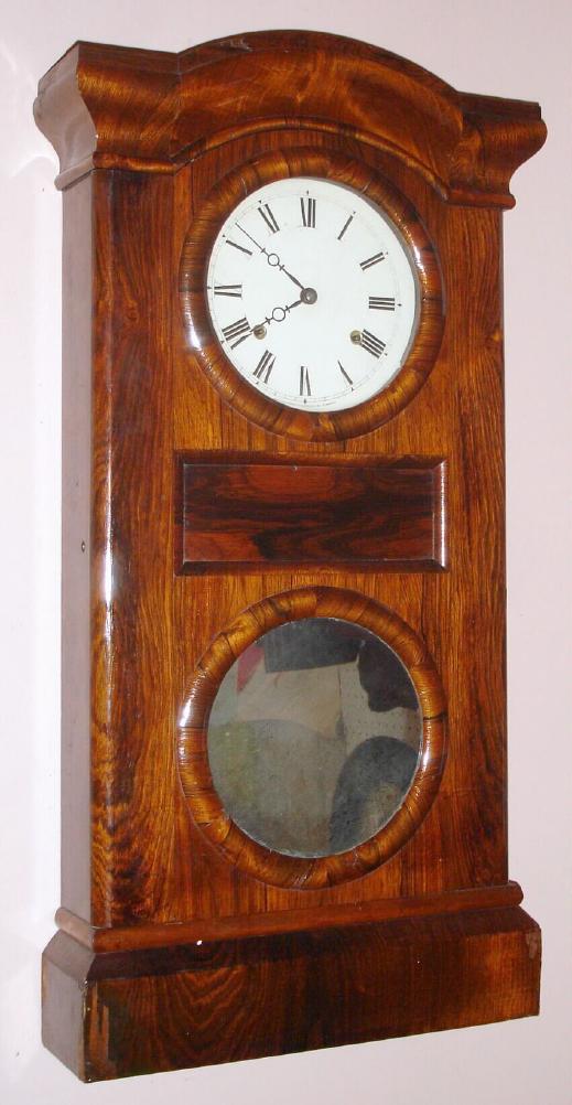 Seth Thomas Clock Co, Thomaston, Conn, Parlor shelf clock in rosewood, 2-weight gong striking, 8-day. This model most commonly occurs as a double dial calendar clock, however a few were made without the calendar. The door has standard t/s clock operating instructions, C.1868 — Antique Clocks Price Guide