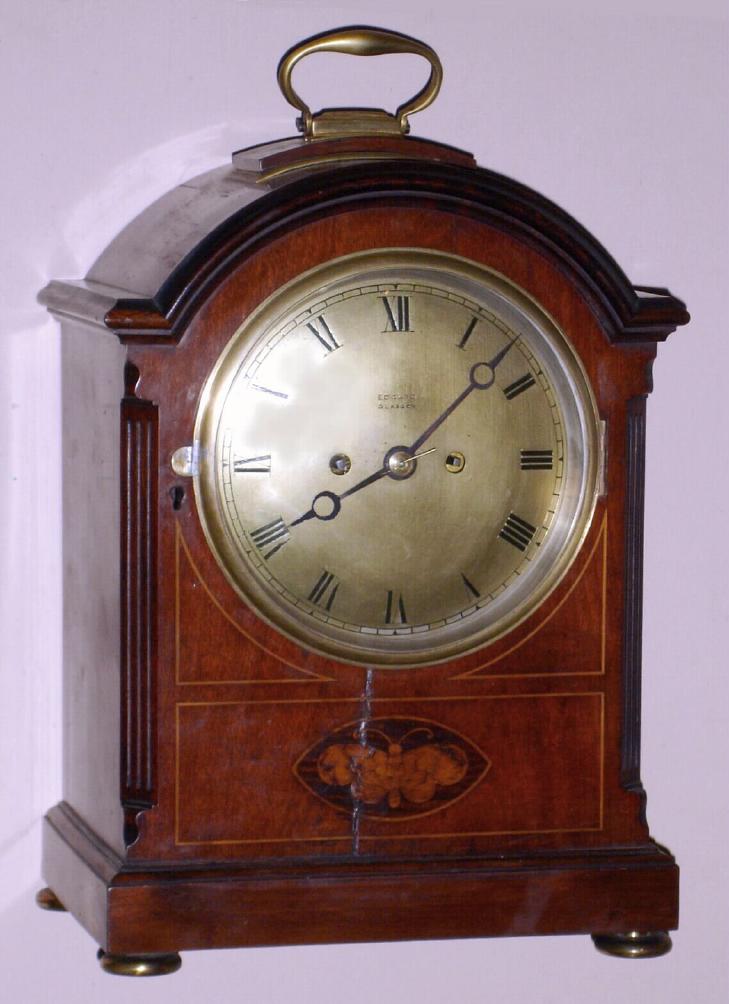 English /Scottish, Regency bracket clock, 2-fusee, time and strike in a mahogany case with inlay to the front panel, 8-day, with cathedral gong strike, and with 7 inch silvered dial bearing name of retailer Edward, Glasgow. — Antique Clocks Price Guide