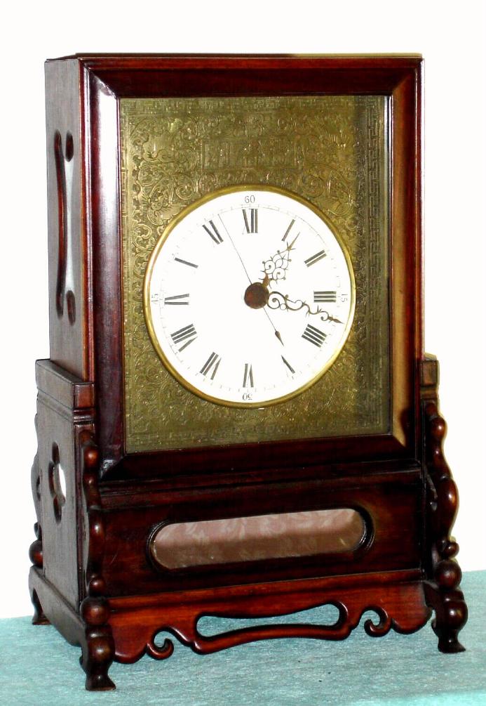 Chinese, double chain fusee, crown verge table clock with stand, a round porcelain dial on a tooled brass mask with oriental designs, and with center seconds hand, 8-day, C.1995 [modern] — Antique Clocks Price Guide