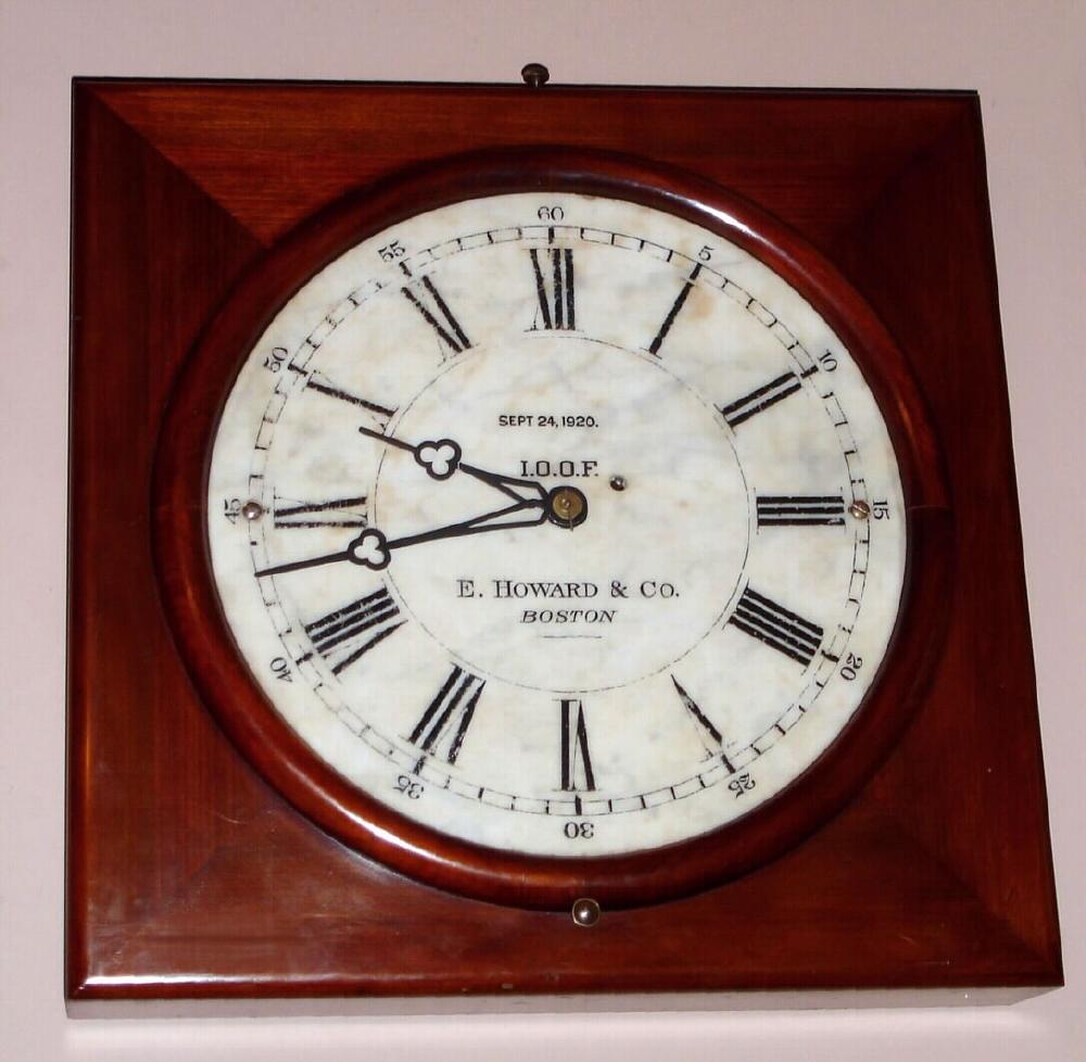 E. Howard Clock Co., Boston, MARBLE DIAL clock in a square mahogany case with 16 inch round marble dial, inscribed for the Independent Order of Odd Fellows, Sept 24, 1920, the mahogany case measuring 22 inches on each side. — Antique Clocks Price Guide