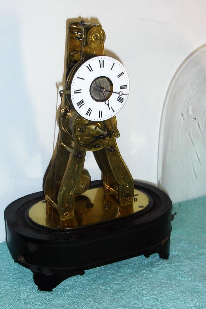 French for the Great Exhibition of 1851, mini skeleton, time and alarm, this model with the front surfaces of the plates engraved, pendulum with a blossom engraved, and the base marked Ms. Honorables, Exp, Paris-Londres, with dome — Antique Clocks Price Guide