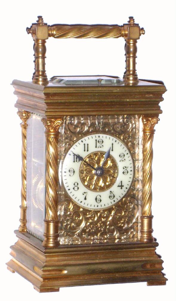 French, brass cased time, strike and repeat carriage clock, in an attractive case with candy twist columns and handle, and with a lovely floral mask surrounding the porcelain dial, c.1900 — Antique Clocks Price Guide