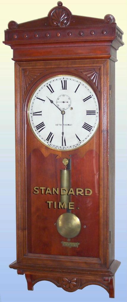 Seth Thomas Clock Co., c.1909, 'REGULATOR No. 30', fine wall clock in cherry, and with "Standard Time" gold leaf on original glass, weight driven, 8-day, C.1900. — Antique Clocks Price Guide