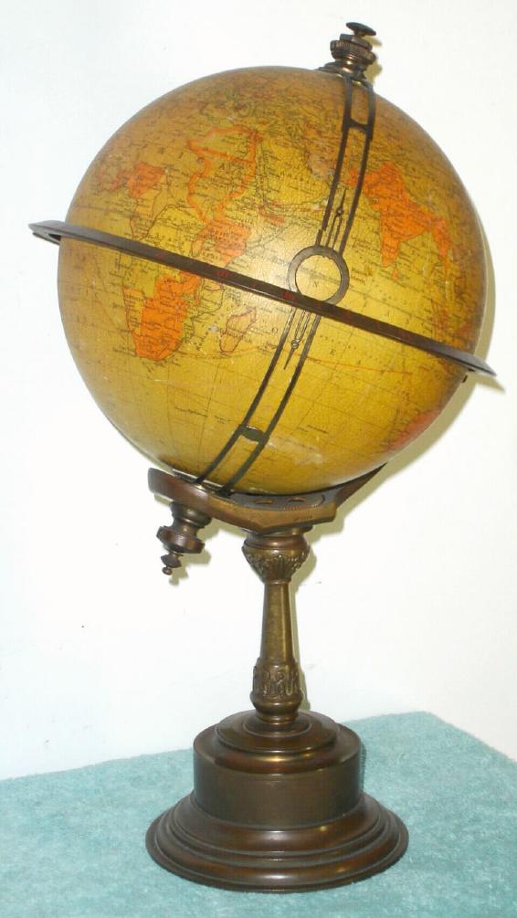 French, for the English market, C.1910, RICHARD'S CHRONOSPHERE {time globe}, made up of 12 lithographed gores applied to a 7.5" metal sphere, showing Patent 19460, various early 19th C. depictions such as 'Russian Empire' and 'Chinese Empire', the oceans and continents clearly labeled, with nation/states delicately shaded and showing major rivers and cities, shipping routes, etc. The globe is mounted to a bronze stand, with mov't in base. — Antique Clocks Price Guide