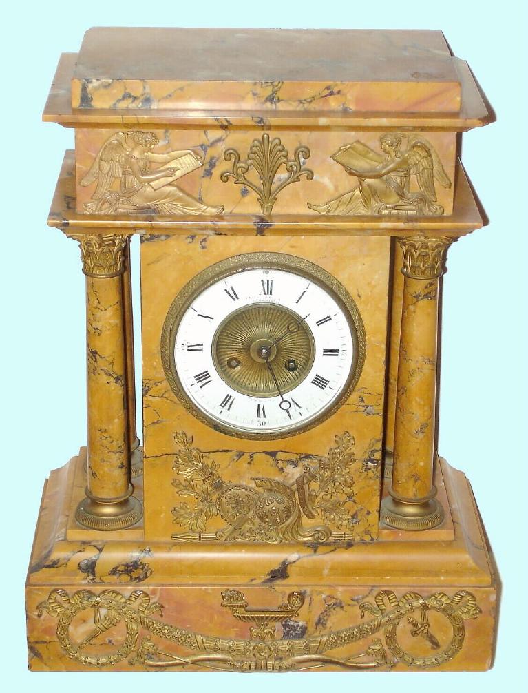 French, Ls. Boname, Seloncourt, for J. E. Caldwell, Philad'a, C.1895, large yellow marble portico clock, with 4 free standing columns, each with Corinthian capitals, and the frontal surfaces with ormolu Greek figures, and with an 8-day gong striking mov't No. 5457. — Antique Clocks Price Guide