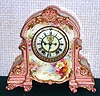 Ansonia Clock Co., C.1895, Royal Bonn, "LA TOURAINE" porcelain china cased clock, with 8-day, gong strike mov't with open escapement on porcelain dial, attractive "beige-pink" color with strong gold highlights.