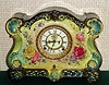 Ansonia Clock Co., C.1915, Royal Bonn, "LA VERGNE" porcelain china cased clock, with 8-day, gong strike mov't with open escapement on porcelain dial, in a multi-colored case, dark green, aqua and yellow with multi colored floral decorations.