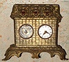 German, Meyer, 'THREE DOGS IN BASKET', all panting with tongues moving in and out with each tick, a small one day pendulum clock on the right side and a thermometer to the left.