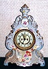Ansonia Clock Co., C.1910, Royal Bonn, "LA LOIRE" porcelain china cased clock, with 8-day, gong strike mov't with open escapement on porcelain dial, in a creamy case with light blue accent and gold highlights.
