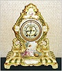 Ansonia Clock Co., C.1910, Royal Bonn, "LA CERDA" porcelain china cased clock, with 8-day, gong strike mov't with open escapement on porcelain dial, with a hand painted portrait of a lady setting in a garden looking in her hand mirror.