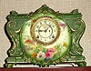 Ansonia Clock Co., Royal Bonn, "LA VINDA", green porcelain clock in the French style, with open escapement on the dial, gong strike, 8-day.
