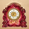 Ansonia Clock Co., C.1910, Standard Line "TARGET" model porcelain china clock in dark violet and with cark violet pansy decorations. Paper dial with brass center.