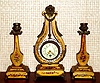 French, Gilt Wood, 3-pc Lyre set, C.1890, small time only pendulum mov't, with swinging brilliant ring, and with 2 matching candle stands, gold leaf with polychrome floral accents.