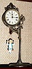 Ansonia Clock Co. New York, "JUMPER NO. 1", C.1896, movement held aloft by a single pole, nickel plated stand, the pin pallet movement released by the ceramic doll jumping up and down. Repro doll with blue vest..
