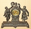 Ansonia Clock Co. New York, C.1896, "FROLIC", one day novelty, cast spelter, showing a farm couple dancing, mov't with silvered dial with embossed floral center.