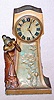 Ansonia Clock Co. New York, C.1906, "TICK TACK", one day desk novelty, cast metal with gold paint finish. Depicts a lady calling and listening for a reply.