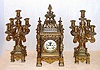 Ansonia Clock Co. New York, C.1906, "REGENT and CANDELABRAS", 3-piece set, 8-day time and strike with open escapement on the dial, the case and candle stands of white metal, brass plated {original}.