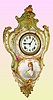 Ansonia Clock Co., C.1906, Royal Bonn, "PORCELAIN HANGING No. 3" china cased wall clock, with portrait on lower case, gong strike, pendulum, 8-day mov't. Case is cream colored with princess in hat with low cut green dress.