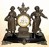 Ansonia Clock Co., New York, C.1880, "PEASANT GIRLS" double statue figural clock [rare model], with open escapement on porcelain dial, gong striking.
