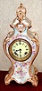 Ansonia Clock Co., Royal Bonn, "LA ROCHELLE", porcelain china clock, with one piece porcelain dial, edges are beige and fields are sky blue, with yellow and violet floral decorations.