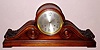 Seth Thomas Clock Co., C.1913, "CHIME CLOCK No. 258" , 8-Bell Sonora chime in a larger than life tambour case with carved accents and with 8 inch dial. Side lever for chime/silent and for tune selection {Whittington and Westminster}.