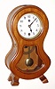 Westminster Clock Co, Korea, Modern, C.1980, small waisted case of light mahogany with a 30-day spring mov't with one at the hour strike [drop off].