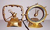 (2) Jefferson Electric Company, Bellwood Ill. "GOLDEN HELM" and "GOLDEN SECRET" models electric mystery clocks. Ht 7" and 8"