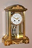 French, crystal regulator retailed by Henry Birks and Co, Montreal 8 day time/strike mvmt with the award medallion of Ls.Boname, Seloncourt, and 'Made in France', in a gilded brass case with Rococo style appliques and presentation on case front. and 2-vial compensating pendulum, c1903