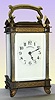 French for Tiffany, Carriage Timepiece, c.1900, in an unusual brass case with reeded columns, cast French feet, pineapple finials and bands of acanthus leaves around top and bottom.