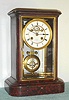 French, Deniere, Paris, Circa 1890, 8-day time/strike red marble and glass "mantel regulator" clock, with open escapement on the dial, and Ellicott style compensating pendulum.