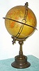 French, for the English market, C.1910, RICHARD'S CHRONOSPHERE {time globe}, made up of 12 lithographed gores applied to a 7.5" metal sphere, showing Patent 19460, various early 19th C. depictions such as 'Russian Empire' and 'Chinese Empire', the oceans and continents clearly labeled, with nation/states delicately shaded and showing major rivers and cities, shipping routes, etc. The globe is mounted to a bronze stand, with mov't in base.
