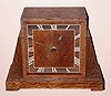 English, c.1925, Astral, going barrel movement, in an oak veneer Art Deco case with MOP inlay for the Roman numerals. Gong strike, 8-day.