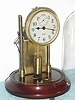 Barr Mfg Corp, Weedsport, NY, EXECUTIVE model, battery powered desk clock, with original glass dome. Note that Barr changed from a pancake style pendulum to a cylindrical style pendulum.