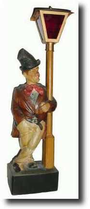 C.1935, German, Whistling Man at Lampost shelf clock — Antique Clocks Price Guide