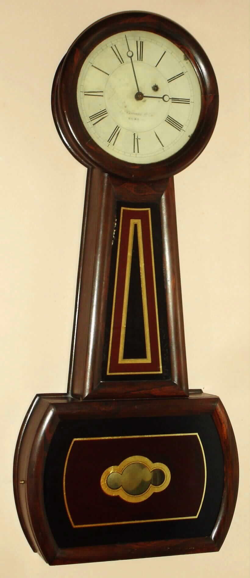 E. Howard and Co., Boston, "No. 3 Banjo", weight driven wall clock, 8-day, in a rosewood grained cherry case, and with reverse painted tablets. C.1860. — Antique Clocks Price Guide