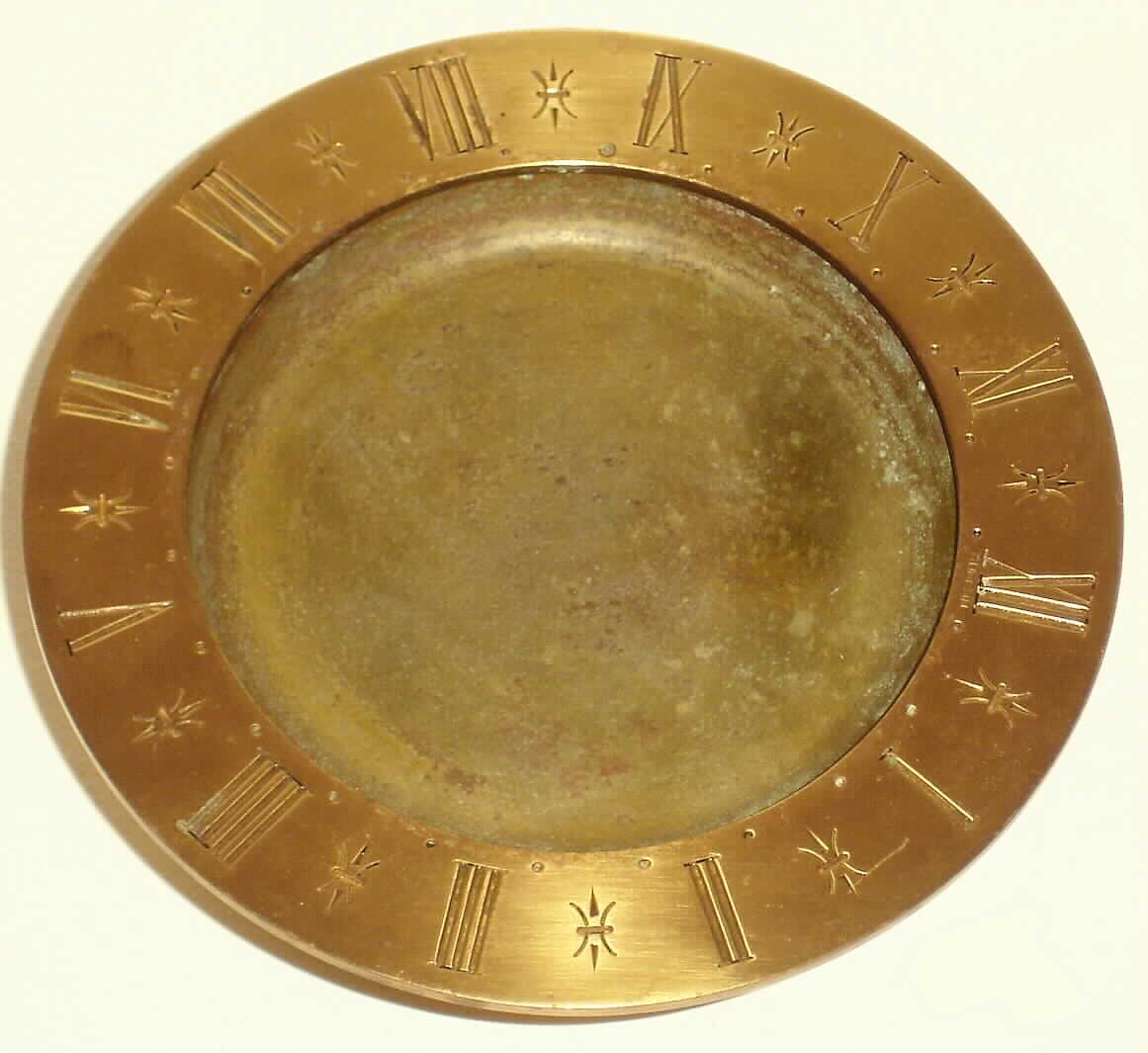 Gubelin Swiss turtle mystery clock in brass with spring wound mechanical movement telling time via turtle (missing) in pond pointing to chapter ring, c1935 — Antique Clocks Price Guide