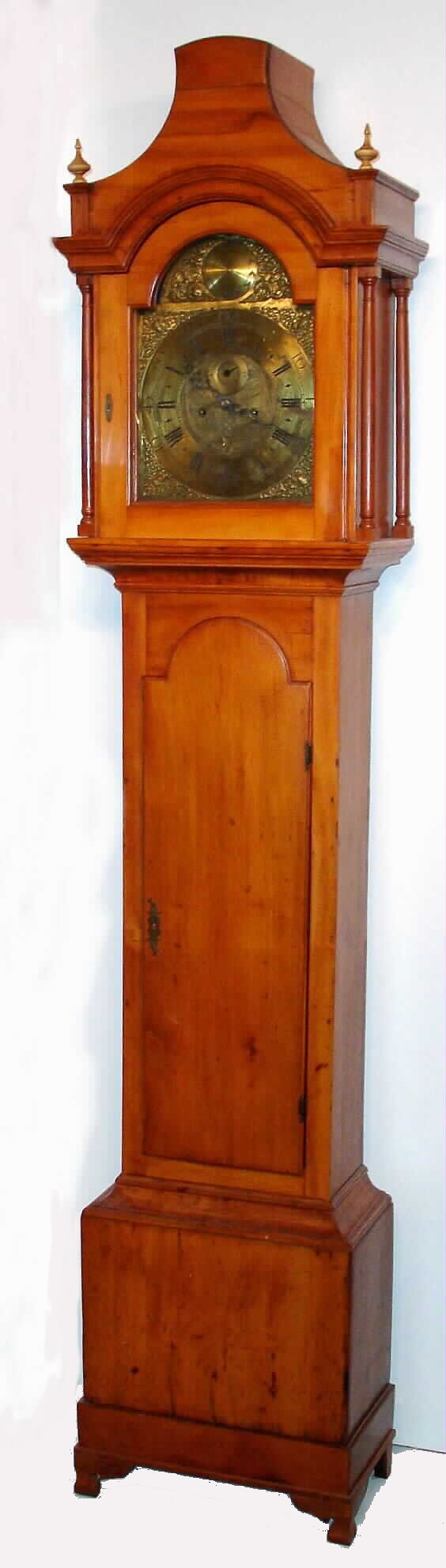 Aaron Miller, American, 8-day, tall case clock, time and strike weight driven, in a gumwood pagoda top case with arched brass dial with cherub spandrels, displaying date aperture at 6 o'clock and second's bit at 12 o'clock and signed Aaron Miller on disc in arch. An early American clock in the English Georgian style, c1760 — Antique Clocks Price Guide