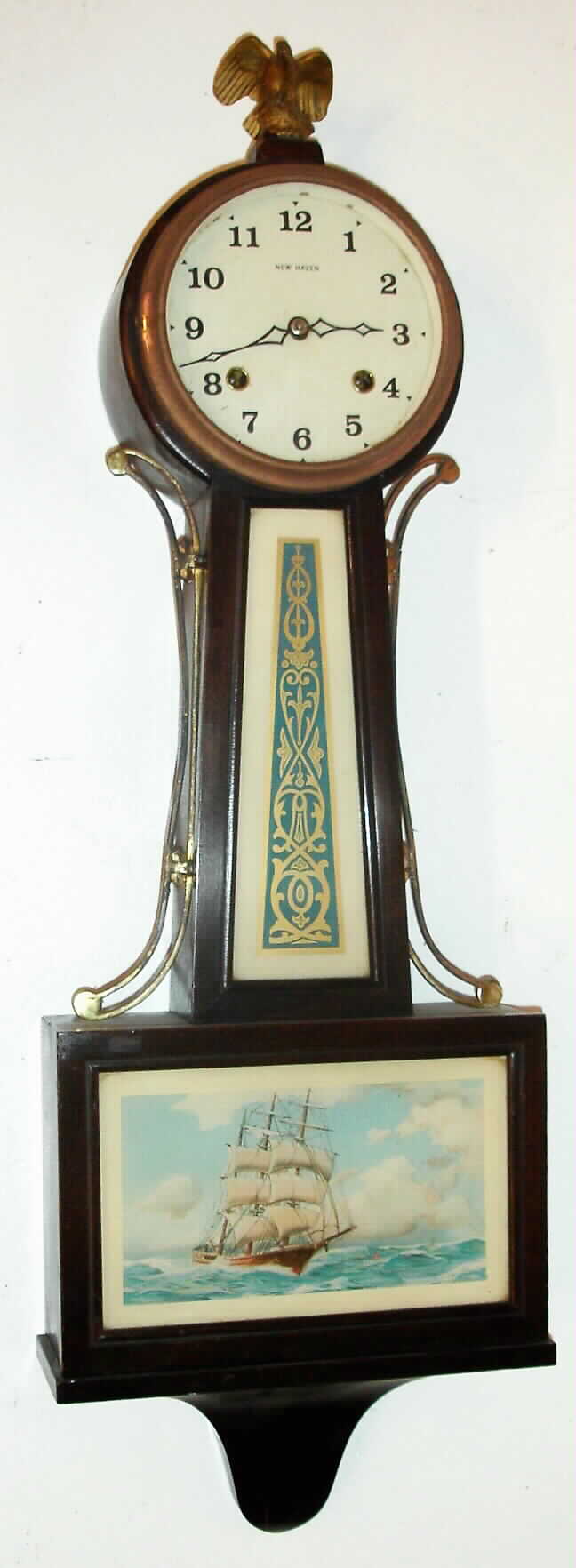 New Haven "Whitney" mahogany 8-day time and strike banjo clock, C.1932. — Antique Clocks Price Guide