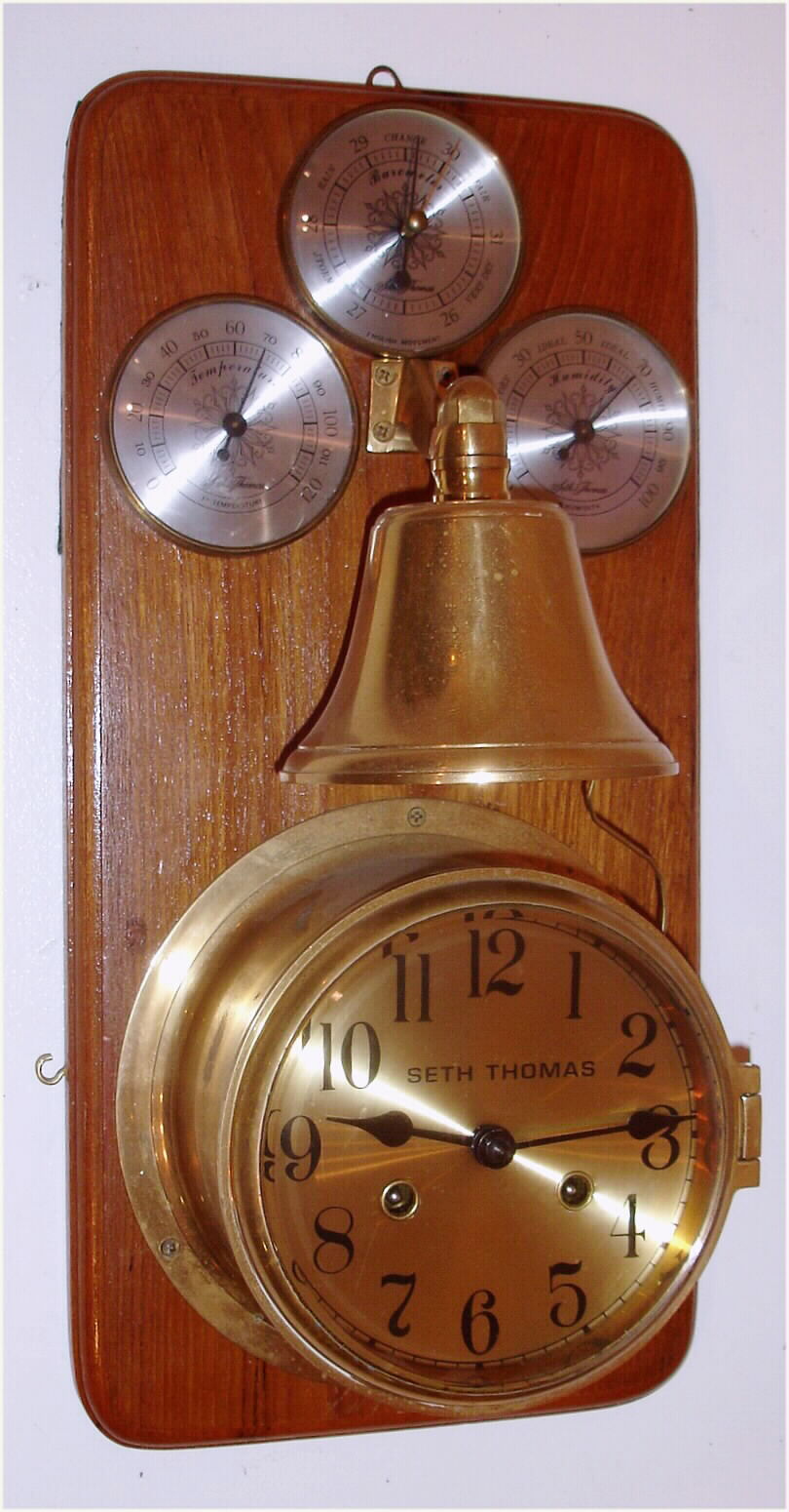 Ship's Clock, dial signed Seth Thomas, modern Hermle movement, on a board with bell and weather instruments, house strike — Antique Clocks Price Guide