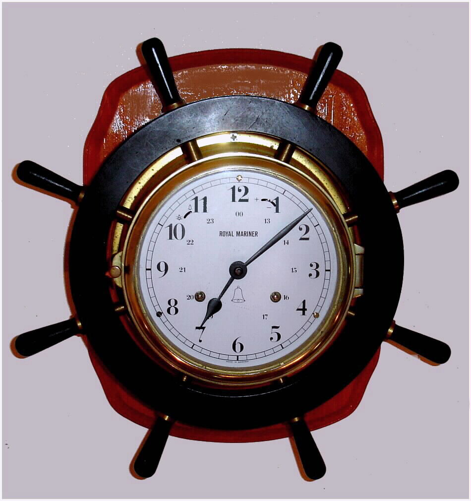 Clocks- (2): Royal Mariner, modern German ship's-bells 8-day mounted marine clock, c2001 and a Newark Clock Co., Newark, N.J. porcelain hanging kitchen clock with German movement c1935 — Antique Clocks Price Guide