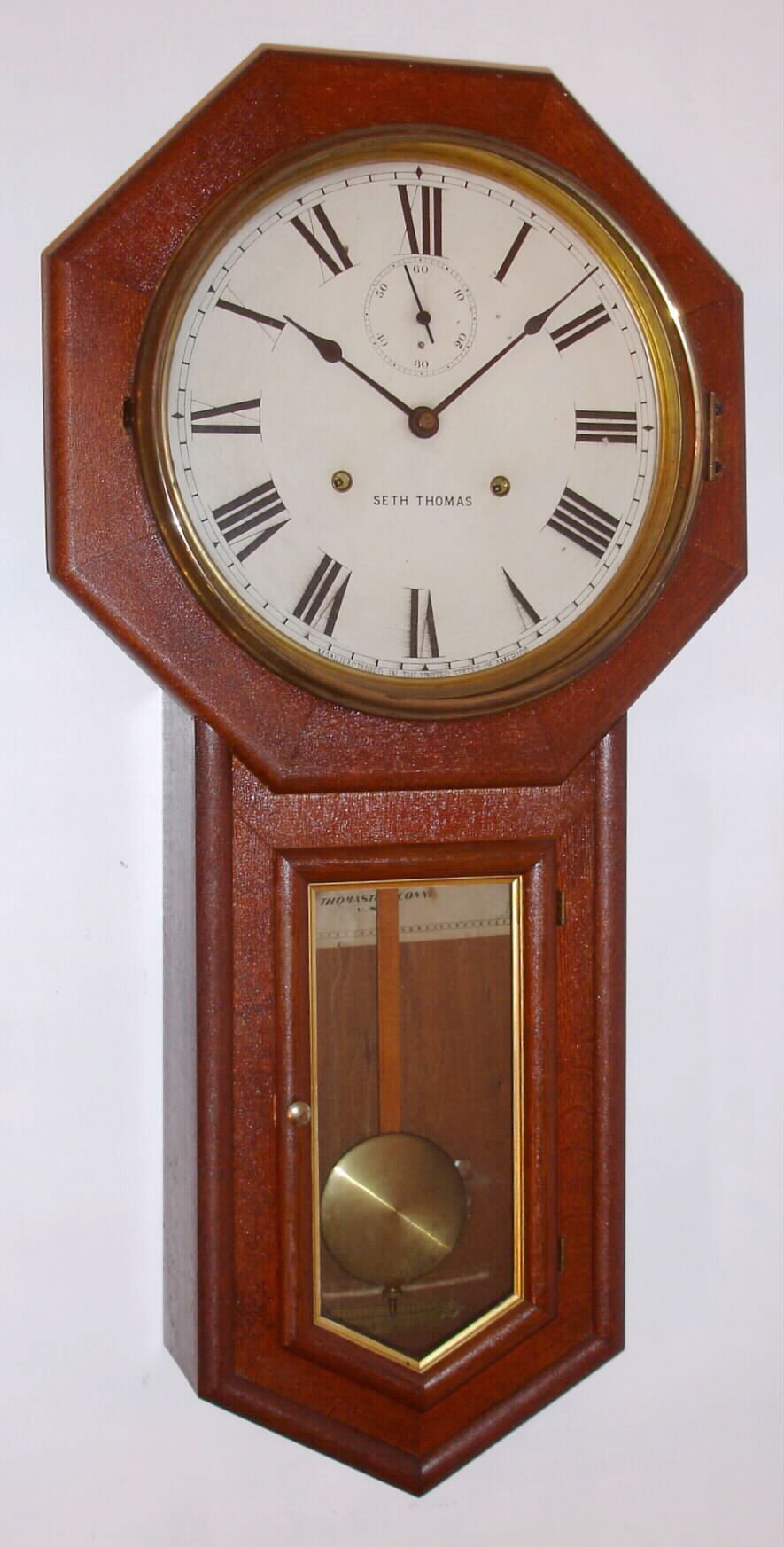 Seth Thomas, Thomaston, Conn., "World" mahogany 15-day time-only long-drop school clock, dated 1905. — Antique Clocks Price Guide