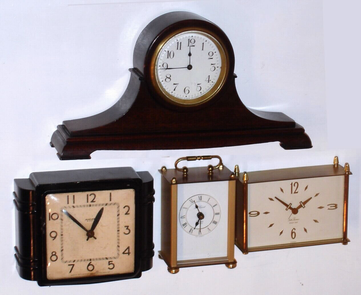 Clocks- (4) table clocks: a New Haven miniature tambour clock, an Ingraham "Miller" 8 day, a Seth Thomas gilt 8 day desk clock with German movement and a Le Gant quartz carriage clock — Antique Clocks Price Guide