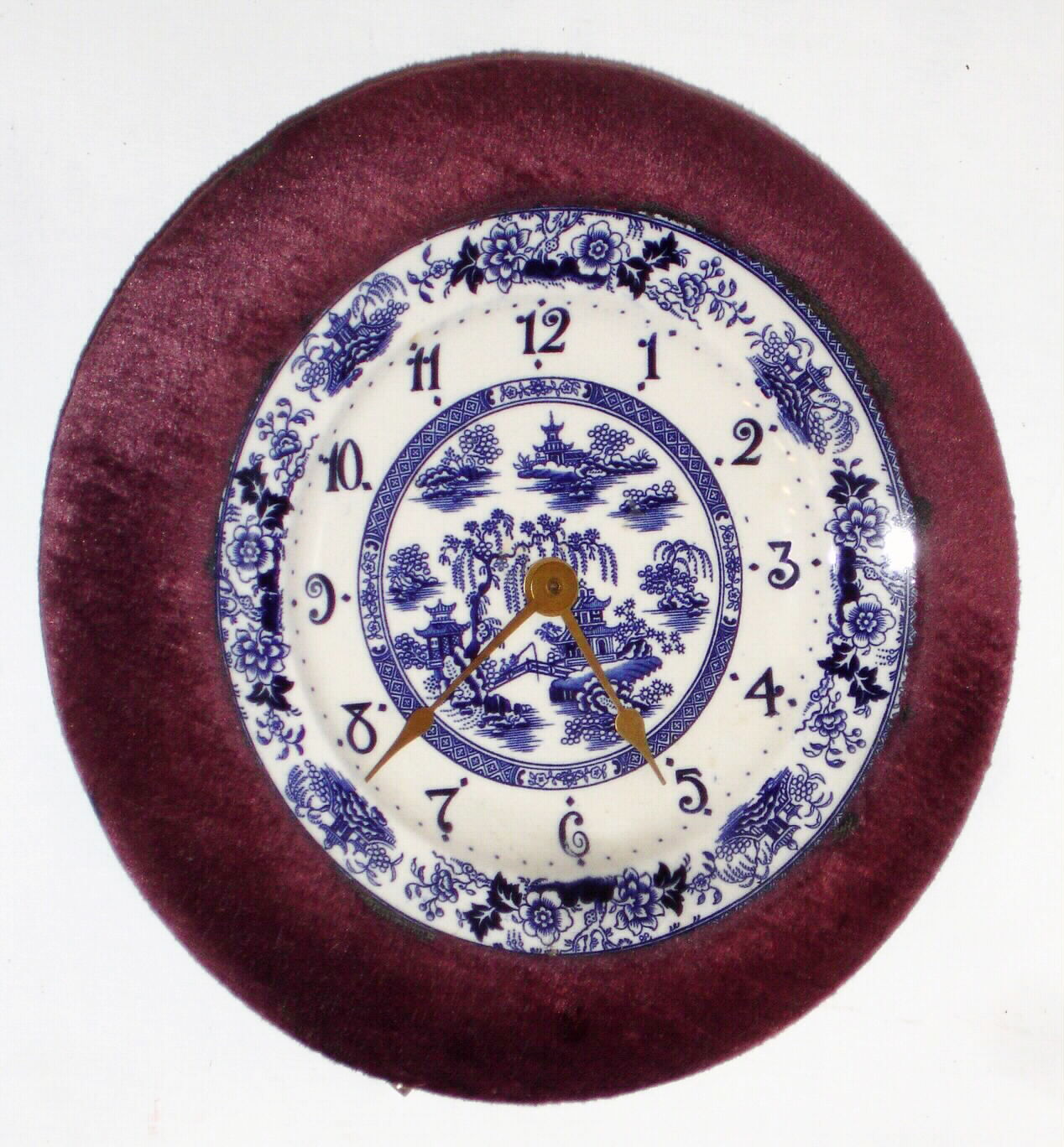 F. Kroeber Clock Co., New York "Plush Plaque No. 1" 30 hour time and alarm spring driven movement with purple plush trim surrounding blue willow porcelain dial, c1890 — Antique Clocks Price Guide