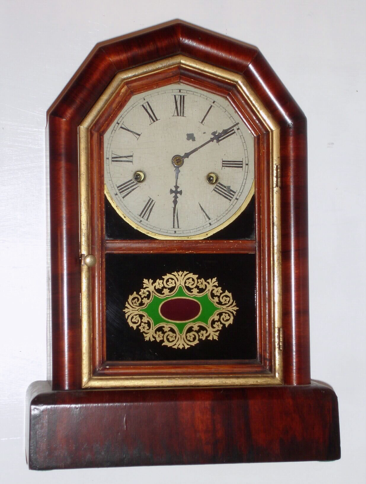 New Haven Clock Co., New Haven Conn. "Octagon Prize" 30 hour time and strike spring driven movement in mahogany veneer case, c1890 — Antique Clocks Price Guide