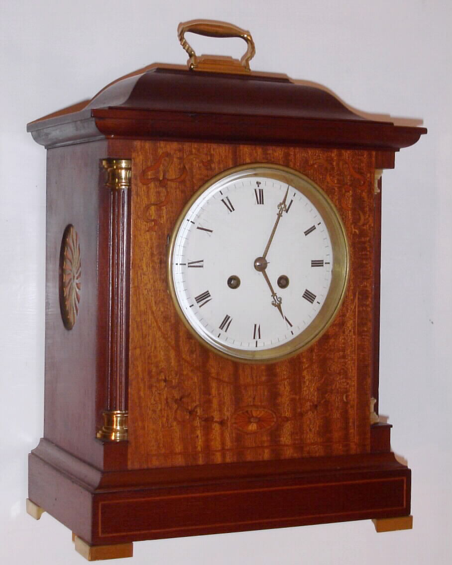 French mantel clock 8 day time and strike spring driven movement stamped "H and H MADE IN FRANCE" in mahogany case with satin wood inlay, fluted quarter columns with brass capitals and brass feet with porcelain dial and beveled glass, c1910 — Antique Clocks Price Guide