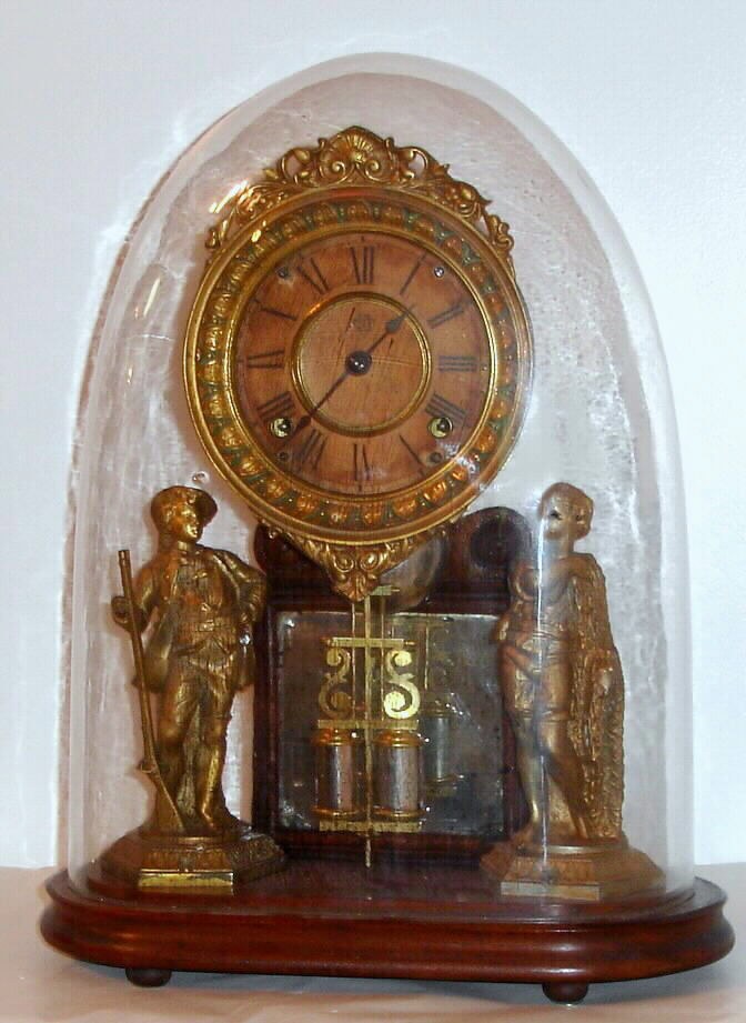 Ansonia Clock Co., Ansonia, Conn. "Crystal Palace" mantel clock 8 day time and strike spring driven movement on walnut base under dome, c1875 — Antique Clocks Price Guide