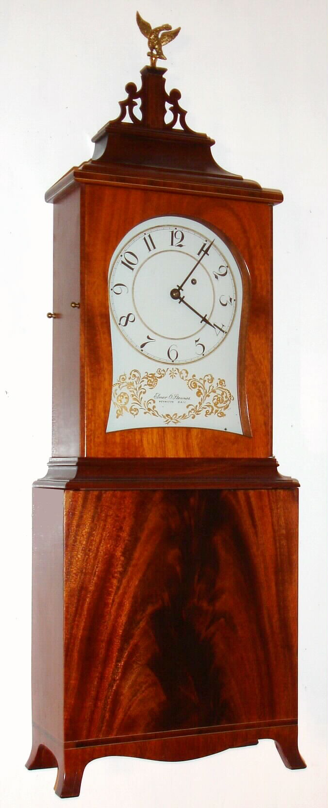 Elmer O. Stennes, Weymouth, Mass., reproduction Massachusetts shelf clock with 8 day time only one weight driven movement in crotch mahogany veneer case with banded inlay across top and base and painted kidney dial, c1971 — Antique Clocks Price Guide
