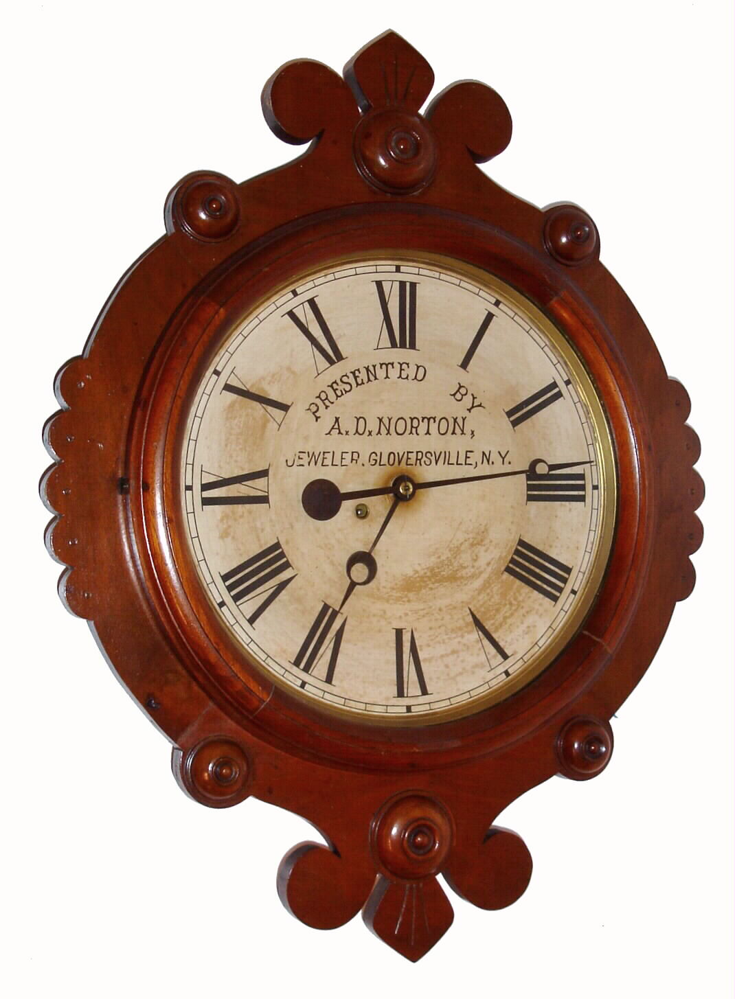 F. Kroeber Clock Co., New York, "Maltese Gallery" wall clock with 8 day time only spring driven pendulum movement in walnut case with paper advertising dial "PRESENTED BY A. D. NORTON JEWELLER GLOVERSVILLE, N.Y.", c1890 — Antique Clocks Price Guide